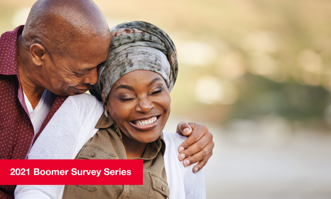 Middle-aged couple embracing, smiling joyfully