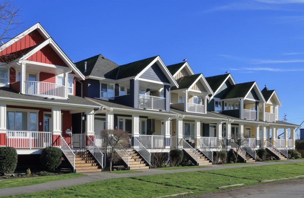 A row of new townhouses during the daytime