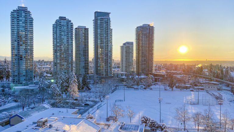 Beautiful winter morning cityscape with rising sun in the background, British Columbia, Canada