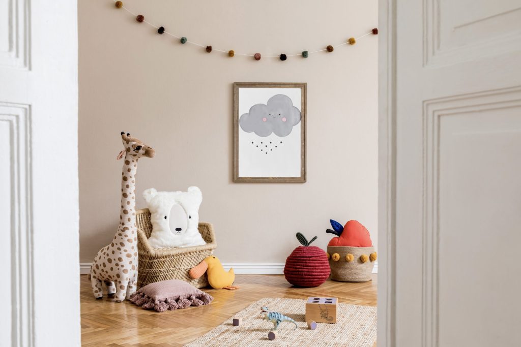 Stylish and modern scandinavian newborn baby interior with mock up photo or poster frame