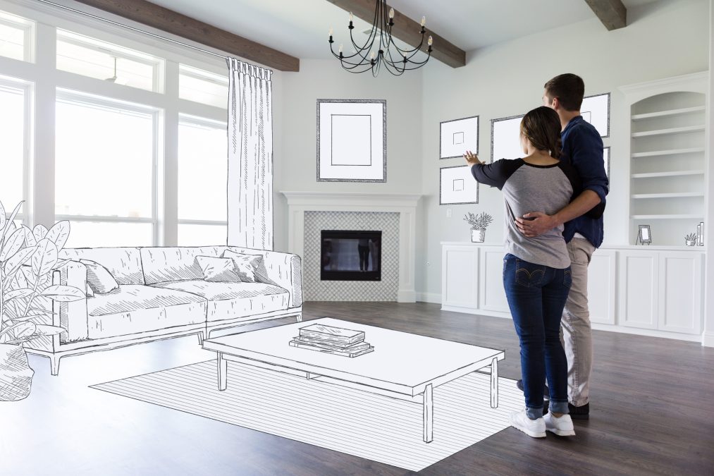 A couple imagines the plans for their future home.