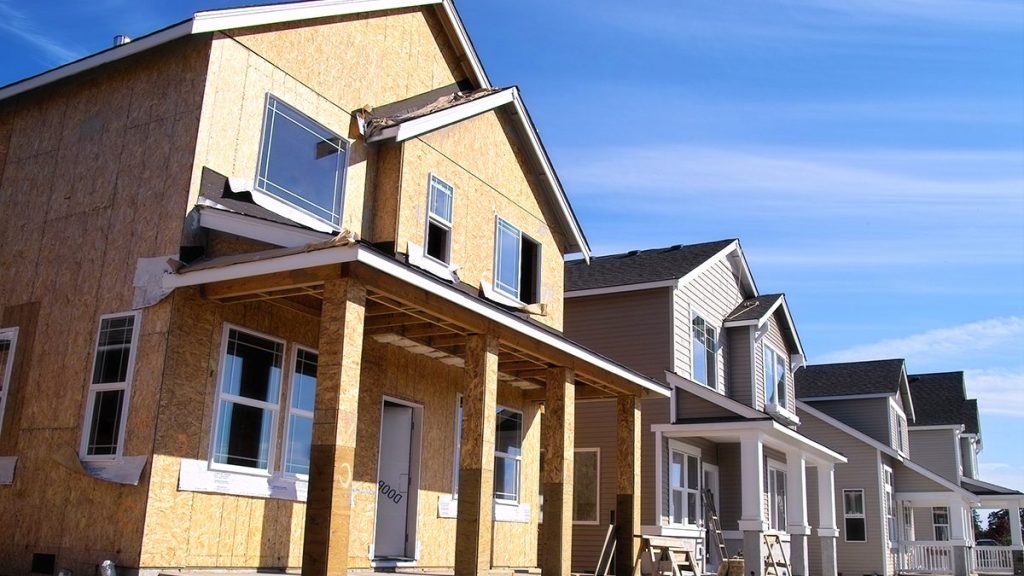 Wide angle photo of a row of houses in a new housing development