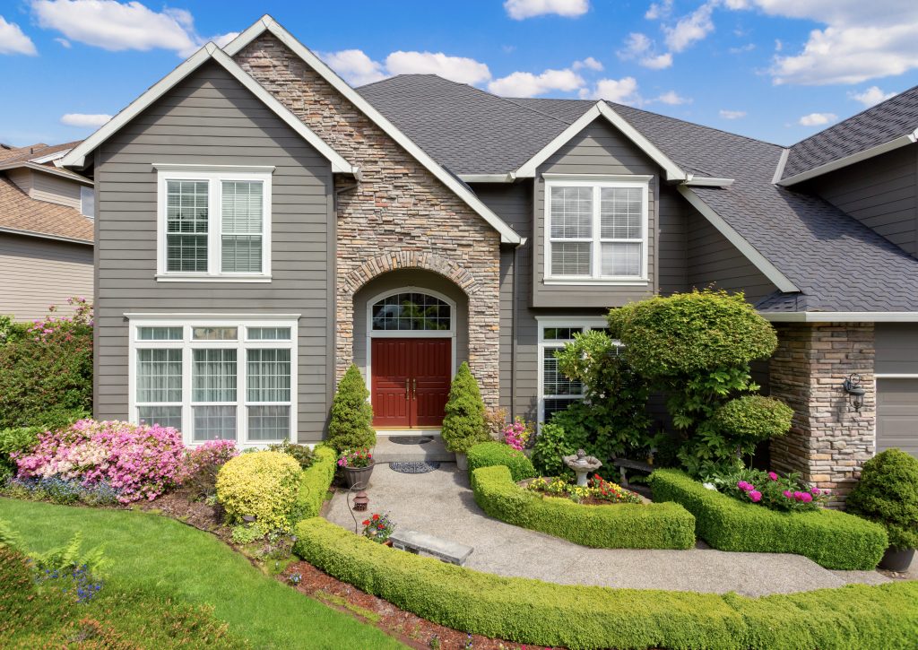 A suburban single-family house with gorgeous outdoor landscaping