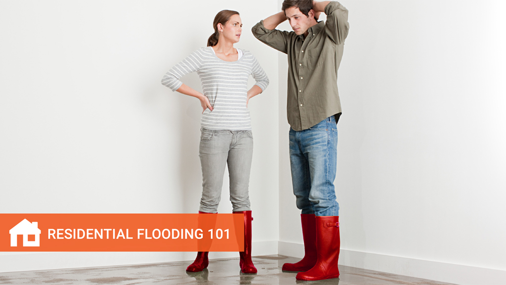 Young couple in wellington boots on flooded floor