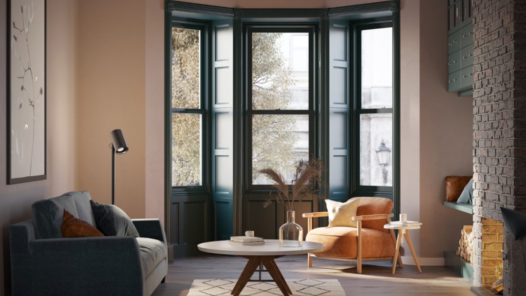 A living room with modern bay windows on a sunny day