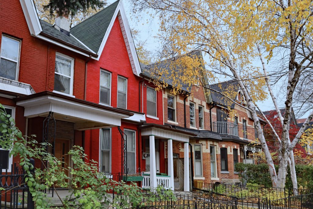 Street of semi-detached Toronto homes in the fall