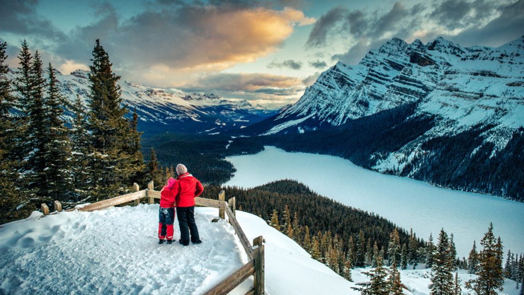 Hikers overlooking mountains in Banff, Alberta