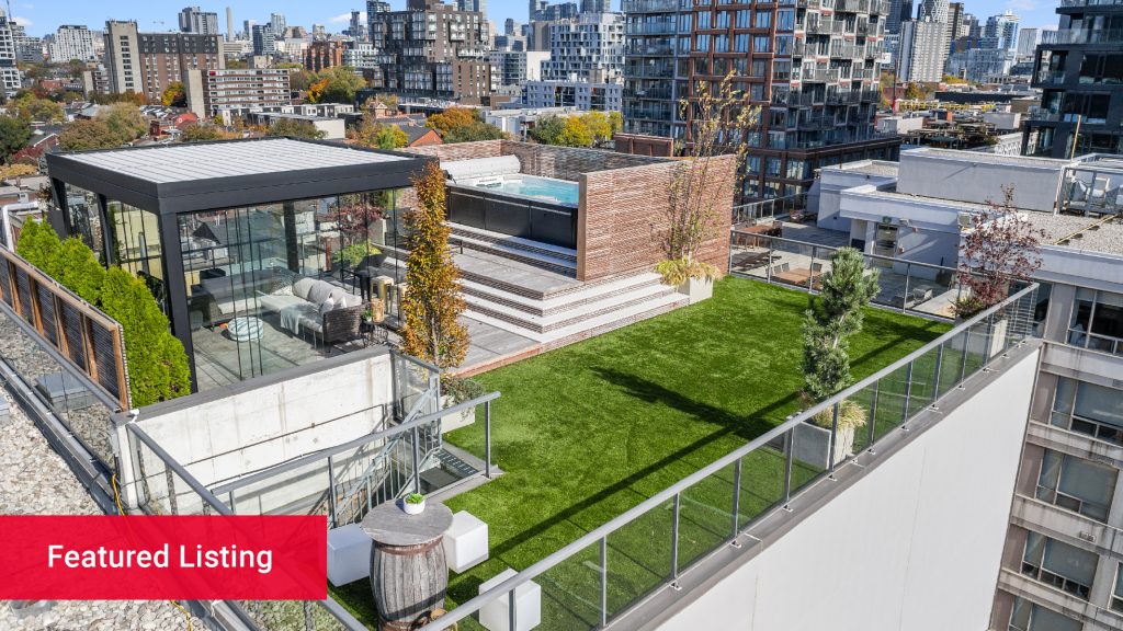 A rooftop terrace with a lawn during the day in downtown Toronto