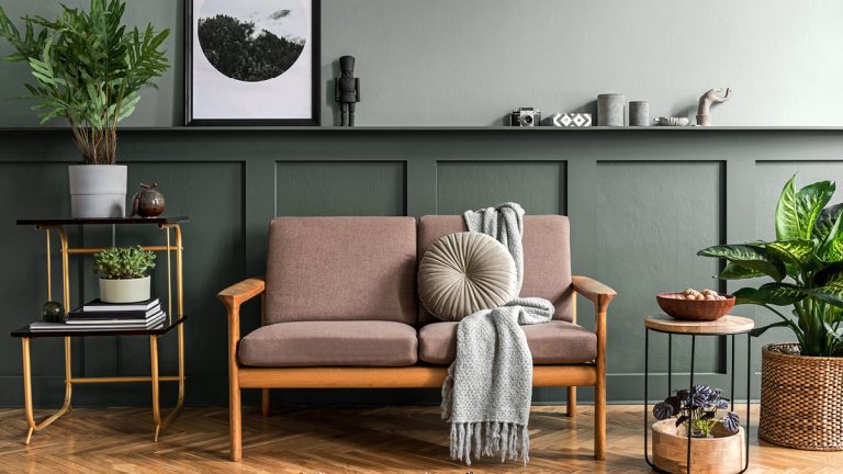 A brown mid-century modern sofa in a modern living room