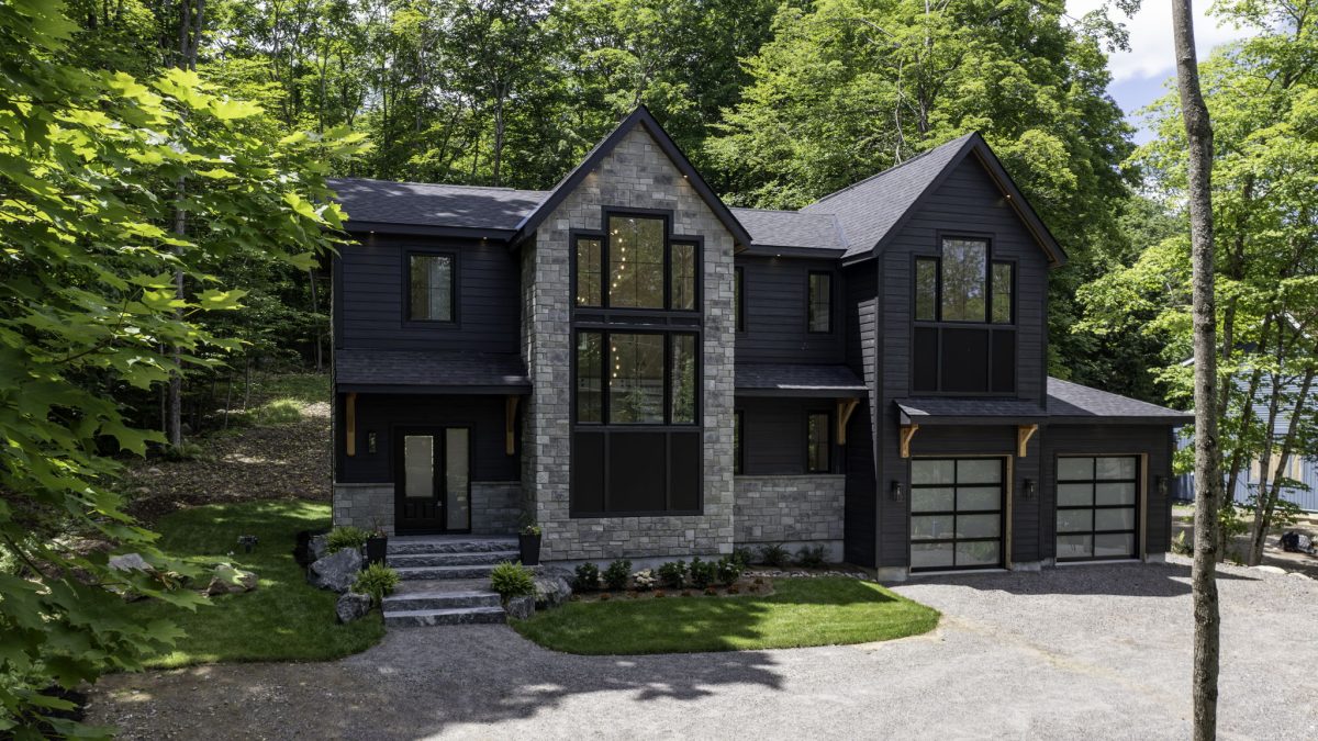 A grey and blue house in the Muskokas