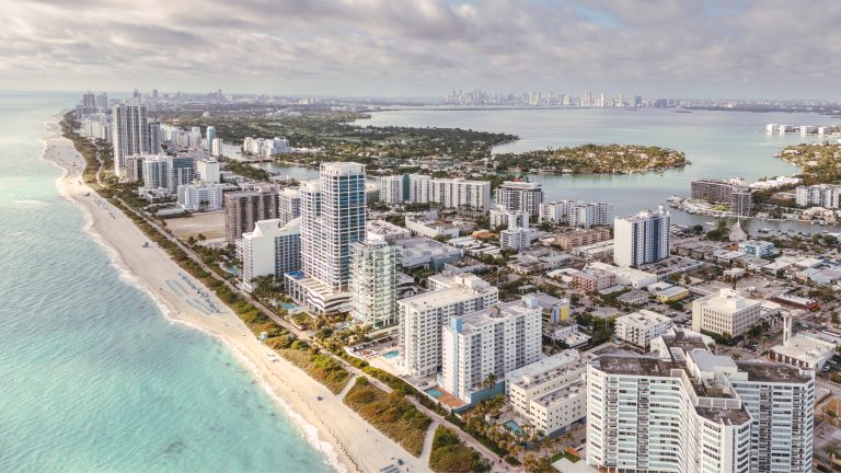 Overhead view of Florida beachfront lined with condo towers