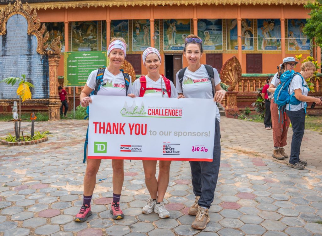 A group of women hold a ‘Thank you’ sign after their hike