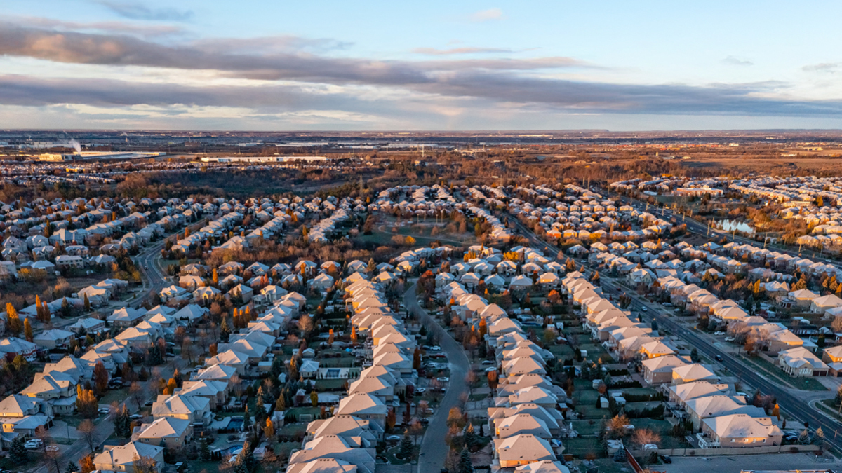 An aerial view of an Ontario subdivision of detached homes covered in snow