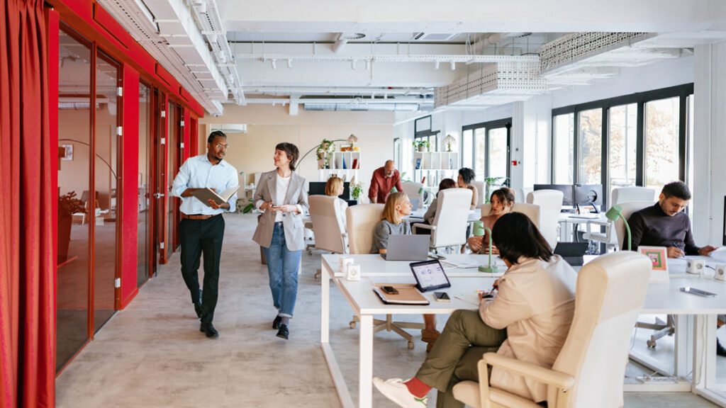 Group of professionals collaborating in a bright, modern office space
