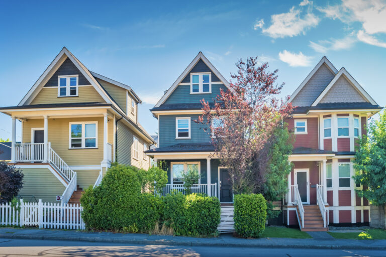 A view of single-family detached homes on a sunny day
