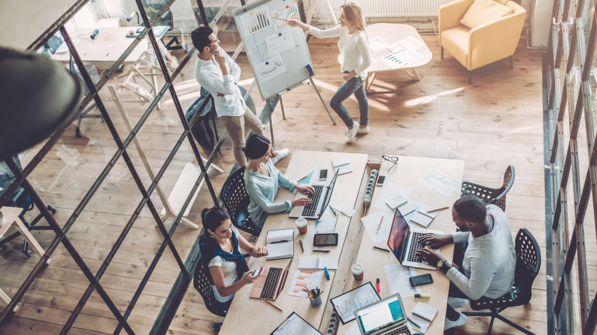 Modern open concept office with workers at desks