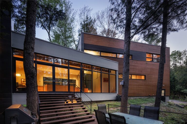 A modern house a dusk in the forest